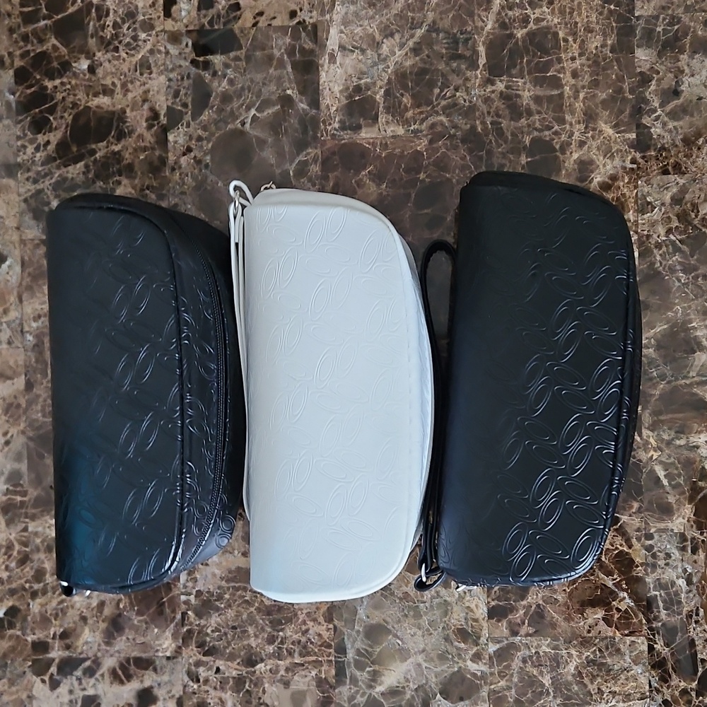 Three Oakley Sunglass Cases